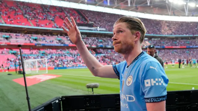 Kevin de Bruyne waves to Manchester City fans after the 2025 FA Cup final at Wembley