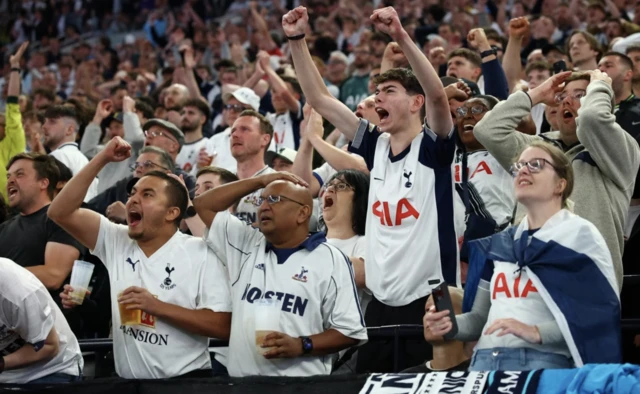 Tottenham Hotspur fans react as they watch the match on screens inside the Tottenham Hotspur