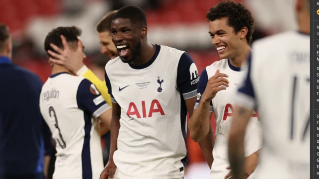 Tottenham Hotspur's Kevin Danso celebrates after winning the Europa League
