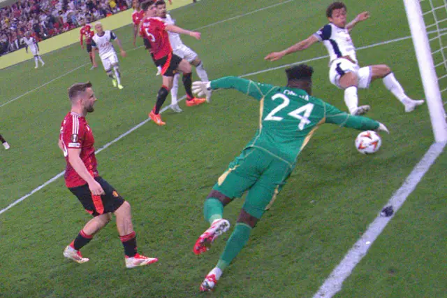 Brennan Johnson (R) scores the opening goal past Manchester United's Cameroonian goalkeeper #24 Andre Onana