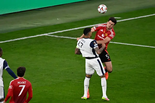 Harry Maguire and Tottenham Hotspur's Argentinian defender #17 Cristian Romero vie for the ball during