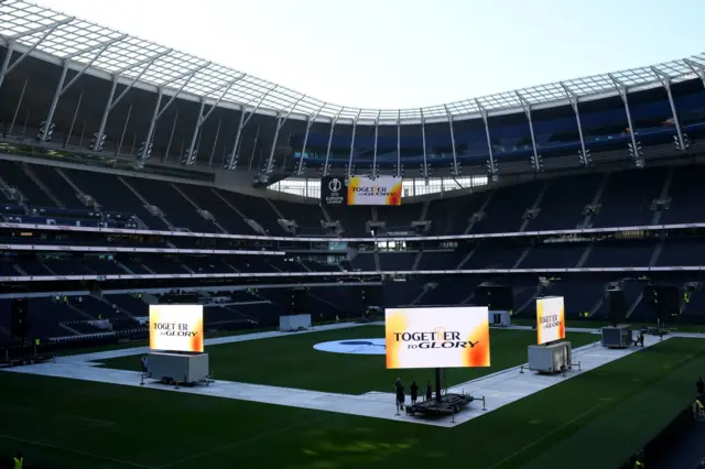 Big screens sit on the pitch at Spurs stadium