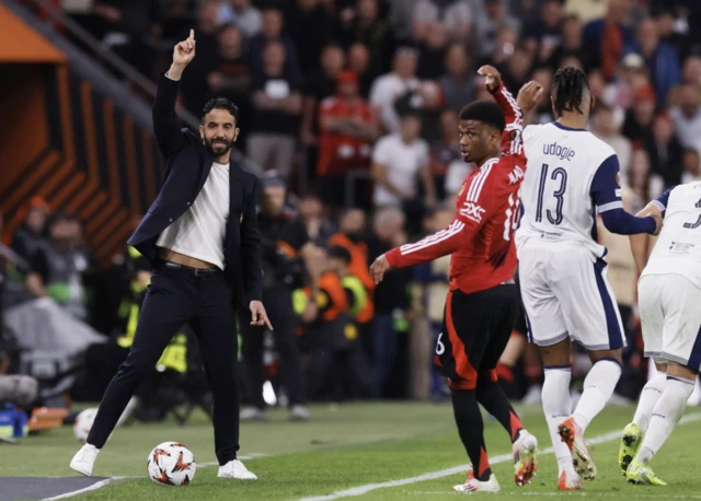 Manchester United manager Ruben Amorim and Manchester United's Amad Diallo react
