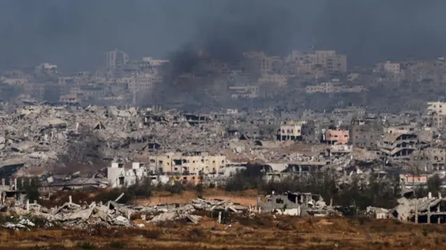 Smoke rises from northern Gaza, as seen from the Israeli side of the Israel-Gaza border, May 21, 2025
