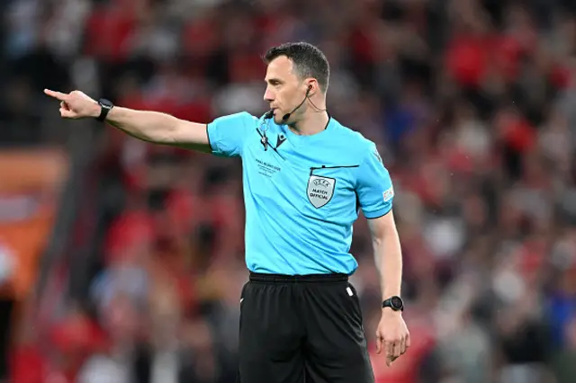 Referee Felix Zwayer looks on