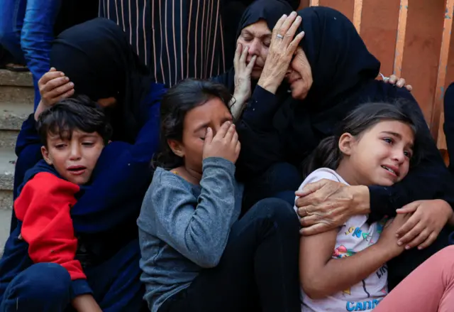 Mourners react during the funeral of Palestinians killed in Israeli strikes, at Nasser hospital, in Khan Younis, southern Gaza Strip, May 21, 2025.