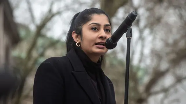 Zarah Sultana speaks at a microphone