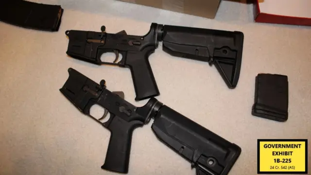An image of gun barrels on the floor
