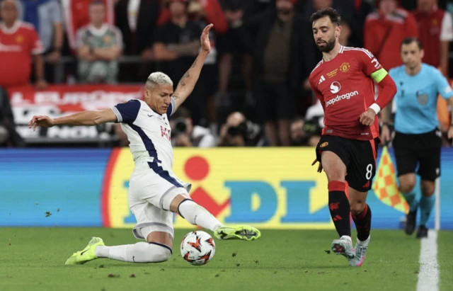 Tottenham Hotspur's Richarlison in action with Manchester United's Bruno Fernandes
