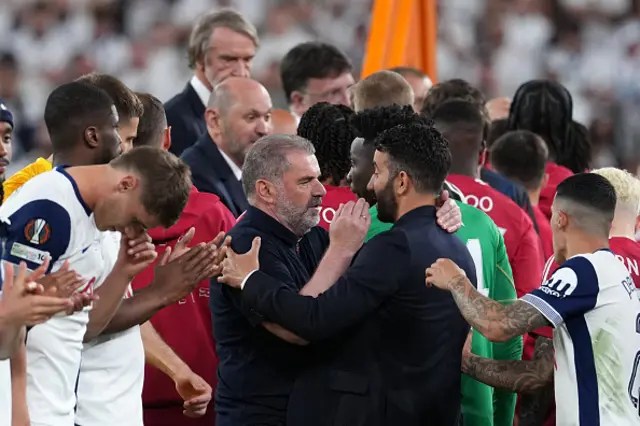 Tottenham Hotspur's Greek-Australian Head Coach Ange Postecoglou (L) ans Manchester United's Portuguese head coach Ruben Amorim speak after the UEFA Europa League final football match