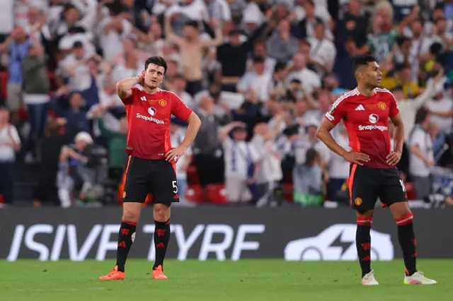 Harry Maguire of Manchester United looks dejected