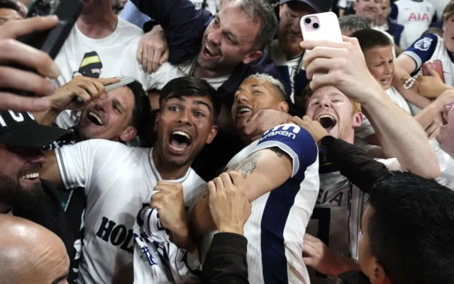 Tottenham Hotspur's Richarlison (centre) celebrates with the fans
