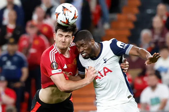 Harry Maguire and Kevin Danso head the ball