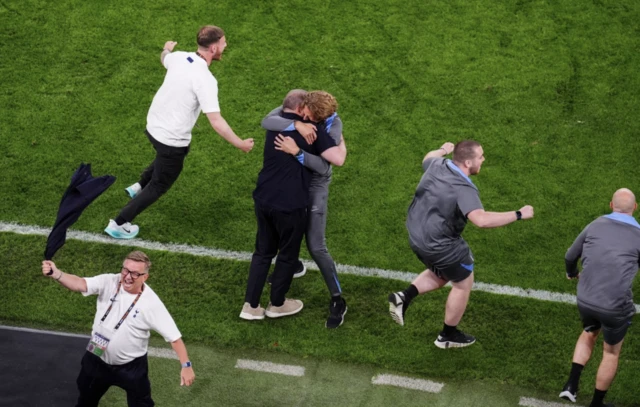 Tottenham Hotspur manager Ange Postecoglou celebrates with his staff