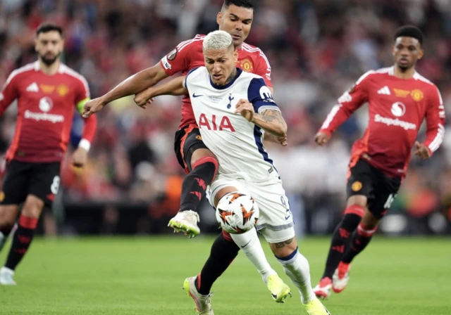 Manchester United's Casemiro and Tottenham Hotspur's Richarlison battle for the ball