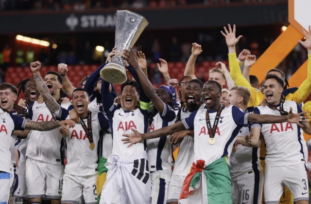 Tottenham Hotspur's Son Heung-min lifts the trophy with teammates after winning the Europa League