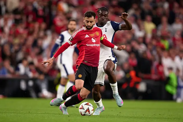 Bruno Fernandes of Manchester United competes for the ball with Yves Bissouma