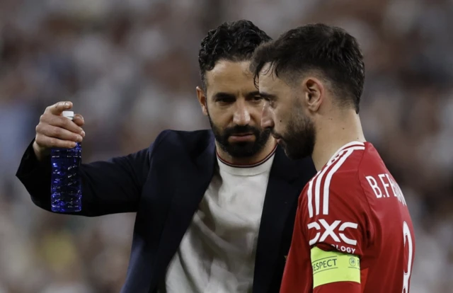 Manchester United manager Ruben Amorim with Manchester United's Bruno Fernandes