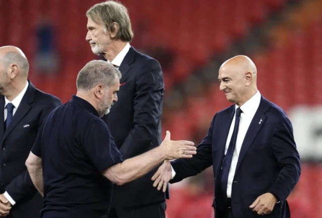 Tottenham Hotspur manager Ange Postecoglou shake hands with Tottenham Hotspur chairman Daniel Levy