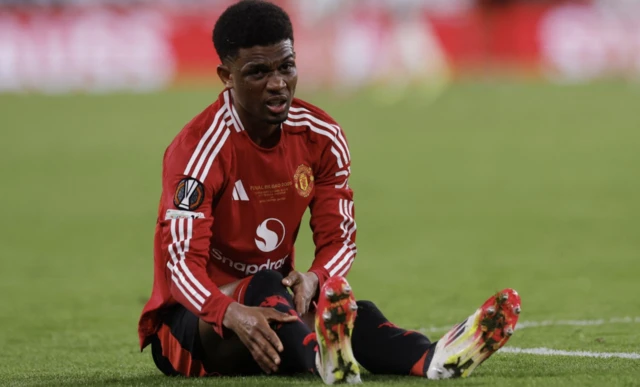 Manchester United's Amad Diallo reacts after sustaining an injury