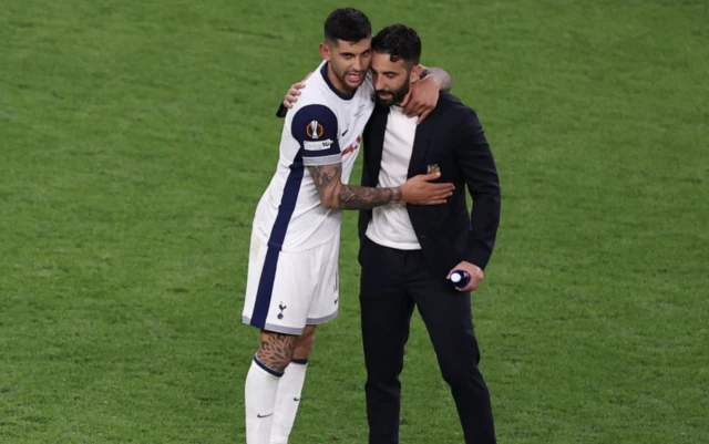 Tottenham Hotspur's Cristian Romero talks to Manchester United manager Ruben Amorim after winning the Europa League final