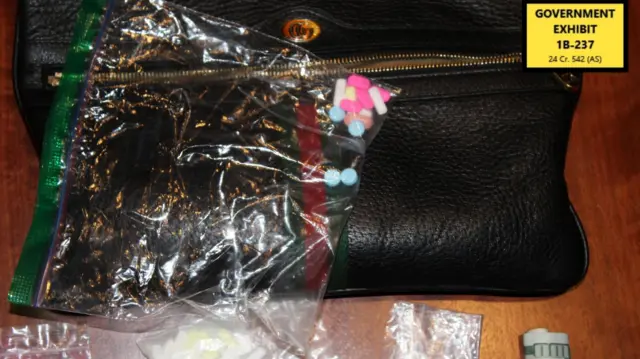 A government exhibit image showing a dark Gucci bag and plastic bags containing different colour pills