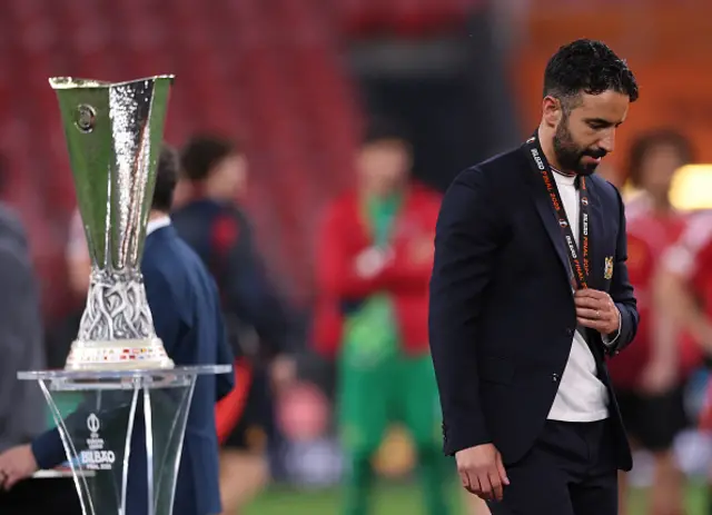 Ruben Amorim, Manager of Manchester United, walks past the UEFA Europa League Trophy