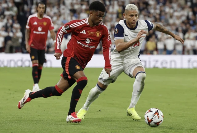 Manchester United's Amad Diallo in action with Tottenham Hotspur's Richarlison