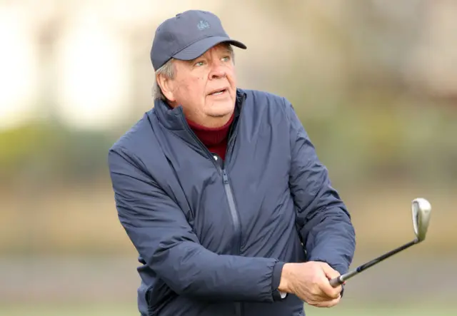 Johann Rupert, The Chairman of Richemont tees off on the 10th hole during day one of the Alfred Dunhill Links Championship 2024 at Carnoustie Golf Links on October 03, 2024 in Carnoustie, Scotland