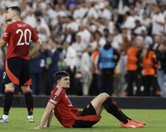 Manchester United's Harry Maguire looks dejected
