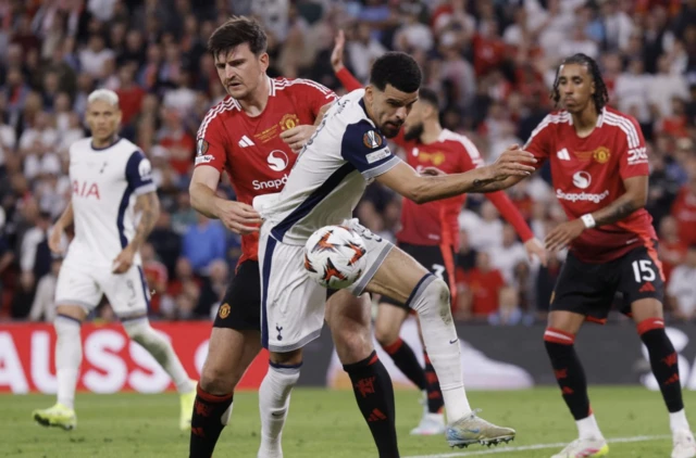 Manchester United's Harry Maguire in action with Tottenham Hotspur's Dominic Solanke