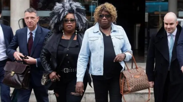 Chagossians Bertice Pomp (centre, left) and Bernadette Dugasse (centre, right) arriving at the High Court this morning