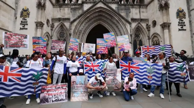 Chagossian protesters outside the High Court earlier today