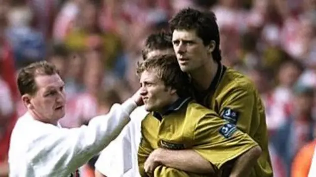 Niall Quinn consoles Michael Gray after his penalty miss in the 1998 play-off final