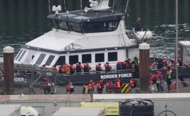 This pictures show migrants being brought to shore in Dover on Wednesday