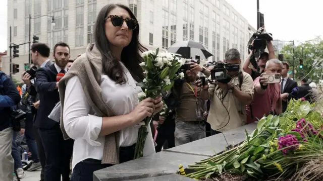 U.S. Rep. Sara Jacobs pays respects with flowers at the Capital Jewish Museum, near the site where two Israeli embassy staff were shot dead.