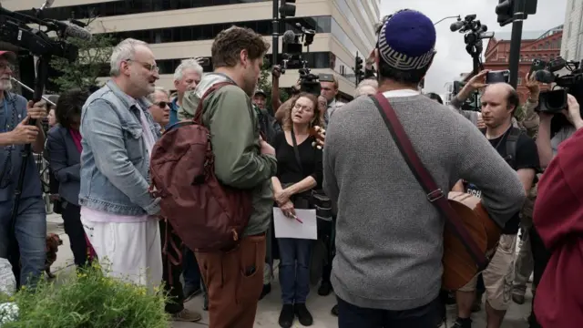 People hold a vigil near the Capital Jewish Museum in Washington DC. Photo: 22 May 2025