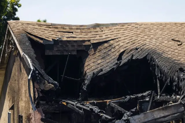 A roof completely caved in from the crash