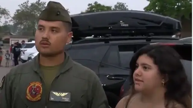 A marine and his wife speaking to Fox News in a car park