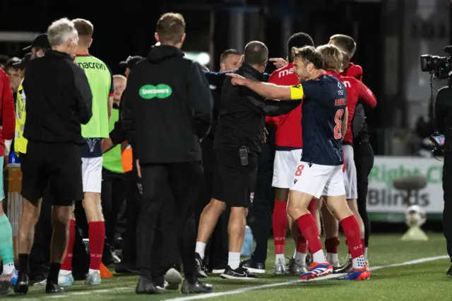 Ugly scenes on the touchline after a confrontation with a fan