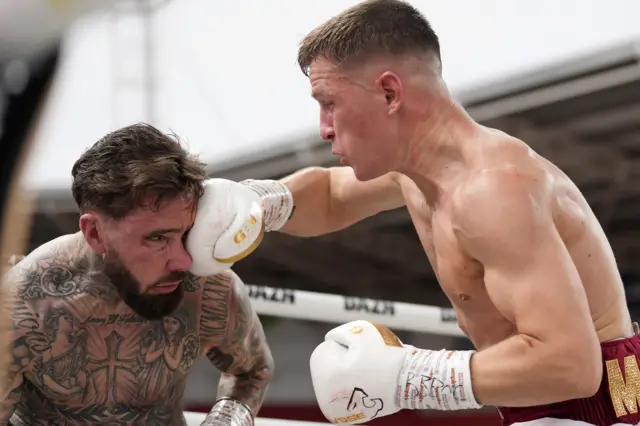Reece Mould lands on the face of Lewis Sylvester