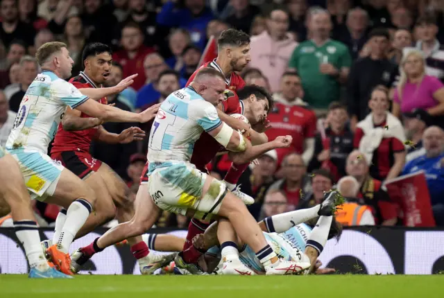 Bath's Sam Underhill challenges Lyon's Davit Niniashvili and is then shown a yellow card