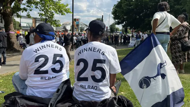 Spurs fans wearing 'winners 25' shirts