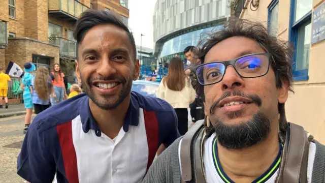 Bobby Seagull and Davy are pictured smiling side by side looking at the camera.