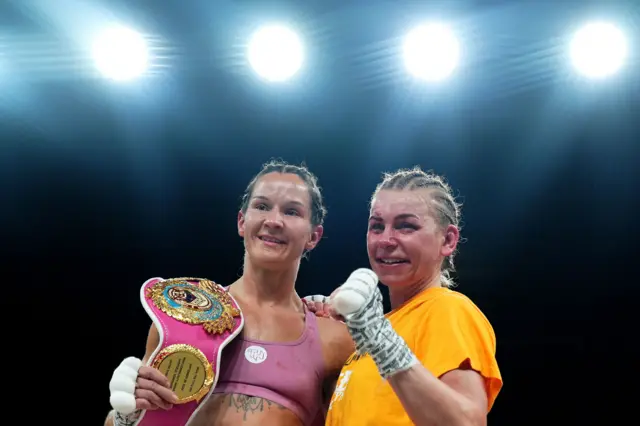 Terri Harper and Natalie Zimmerman with their arms around each other