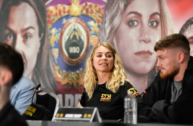 Natalie Zimmermann looks on at a news conference