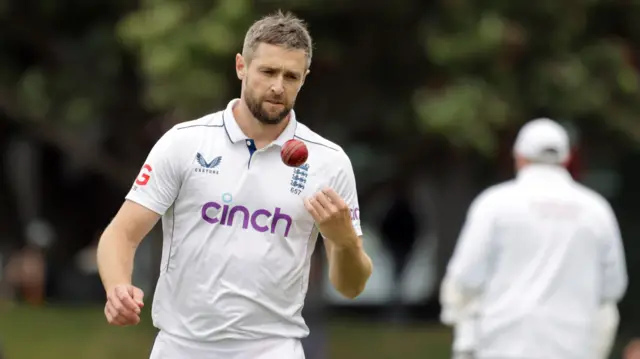 Chris Woakes throws himself a catch as he turns to run in to bowl for England against New Zealand