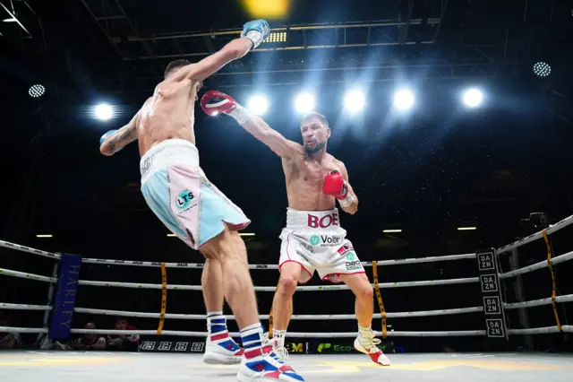 Hughes throws a jab on Sharp