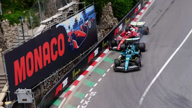 Aston Martin's Lance Stroll and Ferrari's Charles Leclerc collide at the hairpin in Monaco