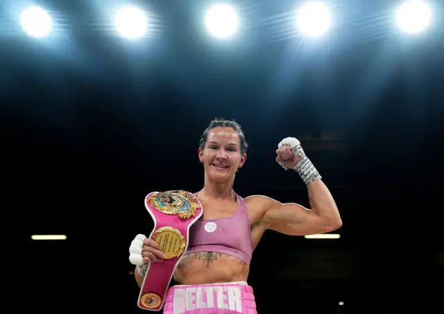 Terri Harper celebrates with her world title on her shoulder
